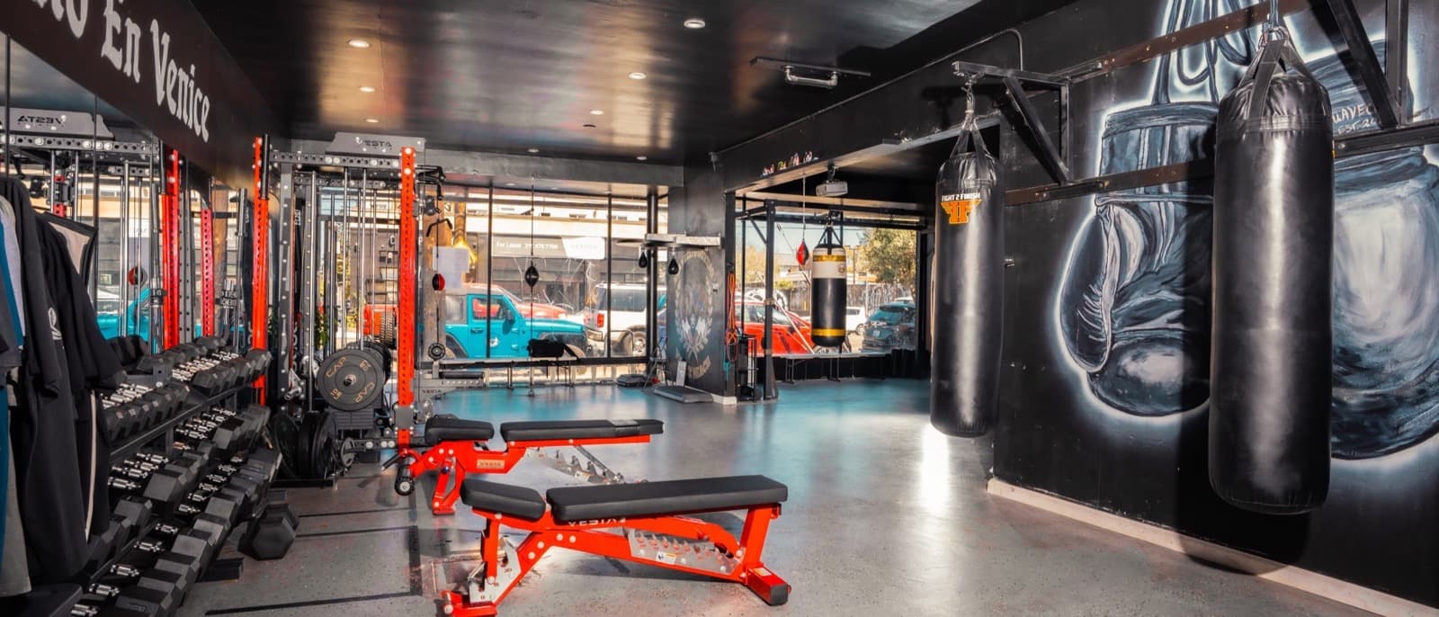 The Suavecito Boxing studio floor with heavy bags